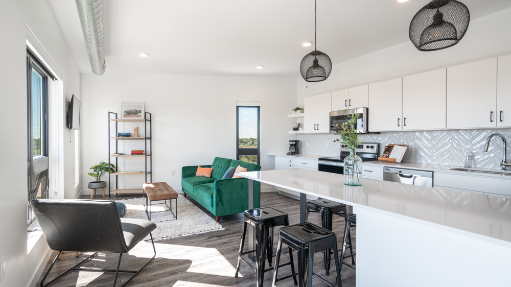 Brio building furnished living room and kitchen